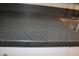 Detail of a sleek countertop complemented by a stainless steel sink at 930 W Mackenzie Dr, Phoenix, AZ 85013