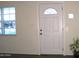Inviting entryway featuring a white door with decorative glass and a sidelight window at 930 W Mackenzie Dr, Phoenix, AZ 85013