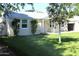 Quaint home with mature landscaping and a lush green lawn, creating a serene setting at 930 W Mackenzie Dr, Phoenix, AZ 85013