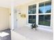 Charming front porch with brick flooring, window, and a welcoming entryway at 930 W Mackenzie Dr, Phoenix, AZ 85013