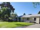 Charming single-story home with a well-manicured lawn and lovely curb appeal at 930 W Mackenzie Dr, Phoenix, AZ 85013