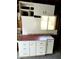 Garage interior featuring storage, a workbench, and natural light at 930 W Mackenzie Dr, Phoenix, AZ 85013