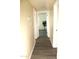 Hallway with light colored walls and light wood-look flooring at 930 W Mackenzie Dr, Phoenix, AZ 85013