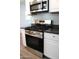 The kitchen features a stainless steel gas range with microwave and gray counters at 930 W Mackenzie Dr, Phoenix, AZ 85013