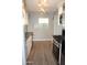 Well-lit kitchen featuring stainless steel appliances and sleek countertops at 930 W Mackenzie Dr, Phoenix, AZ 85013