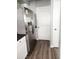 Spacious kitchen area with stainless steel refrigerator and ample cabinet space, with wood-look vinyl flooring at 930 W Mackenzie Dr, Phoenix, AZ 85013