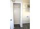 Laundry room with closet, white wire shelving and hookups for washer and dryer at 930 W Mackenzie Dr, Phoenix, AZ 85013