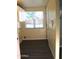 Bright laundry room features vinyl floors, storage, and a window with natural light at 930 W Mackenzie Dr, Phoenix, AZ 85013