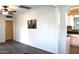 Bright living room with hard surface floors, neutral paint, and a view into the kitchen at 930 W Mackenzie Dr, Phoenix, AZ 85013