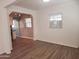 View of the home's open floorplan with a living room that leads into the kitchen at 930 W Mackenzie Dr, Phoenix, AZ 85013