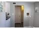 Open living space with a view through an open door frame to an adjacent room at 930 W Mackenzie Dr, Phoenix, AZ 85013