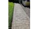 Paver walkway leading to the home, flanked by green lawn and decorative rock at 930 W Mackenzie Dr, Phoenix, AZ 85013