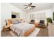Serene main bedroom with natural light, ceiling fan, and minimalist decor at 1024 E Frye Rd # 1090, Phoenix, AZ 85048