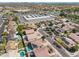 Scenic aerial view featuring homes, a commercial building, and a well-planned community layout, showcasing community features at 11840 N 59Th Ln, Glendale, AZ 85304