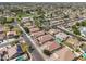 Wide aerial view showcasing houses with pools, well-kept landscaping, and a close-knit community at 11840 N 59Th Ln, Glendale, AZ 85304