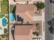 Aerial view showcases a backyard with a pool, complemented by solar panels on the roof in a Gathering neighborhood at 11840 N 59Th Ln, Glendale, AZ 85304