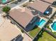 Aerial view of a house highlighting a sparkling pool, a well-maintained lawn, and solar panels on the roof at 11840 N 59Th Ln, Glendale, AZ 85304