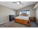 This cozy bedroom features a large bed, matching dressers and natural light at 11840 N 59Th Ln, Glendale, AZ 85304