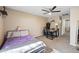Comfortable bedroom features a ceiling fan and desk, offering a functional and relaxing space at 11840 N 59Th Ln, Glendale, AZ 85304