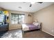 Inviting bedroom with a large window providing natural light and view of the neighborhood at 11840 N 59Th Ln, Glendale, AZ 85304