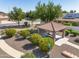 Community park with gazebo, green landscaping, walking path and 'Pet Waste Station' in a well-maintained neighborhood at 11840 N 59Th Ln, Glendale, AZ 85304