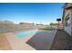Beautiful backyard pool with cool blue water, set against a clear sky and surrounded by a concrete patio at 11840 N 59Th Ln, Glendale, AZ 85304