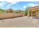 A gravel backyard with low maintenance landscaping and block fence at 121 W Hackberry Dr, Chandler, AZ 85248