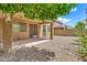 Exterior of the home featuring low maintenance backyard and covered patio at 121 W Hackberry Dr, Chandler, AZ 85248