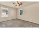 Bedroom with plush carpeting, neutral walls, and two windows offering natural light at 121 W Hackberry Dr, Chandler, AZ 85248