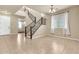 Inviting entryway showcases tile flooring and a staircase, illuminated by natural light through the windows at 121 W Hackberry Dr, Chandler, AZ 85248