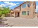 Exterior of the home featuring low maintenance backyard and covered patio at 121 W Hackberry Dr, Chandler, AZ 85248