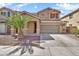 Inviting two-story home showcasing a well-manicured front yard and a convenient two-car garage at 121 W Hackberry Dr, Chandler, AZ 85248