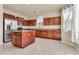 Well-lit kitchen featuring stainless steel appliances, granite counters, and a functional center island at 121 W Hackberry Dr, Chandler, AZ 85248