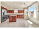 Spacious kitchen featuring stainless steel appliances, granite countertops, and abundant cabinet space at 121 W Hackberry Dr, Chandler, AZ 85248