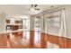 Hardwood floors connect the well-lit living room to the kitchen and backyard, creating a seamless flow at 121 W Hackberry Dr, Chandler, AZ 85248