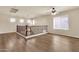 Open loft with hardwood floors, lots of windows, and decorative wrought iron railing at 121 W Hackberry Dr, Chandler, AZ 85248