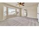 Expansive main bedroom with bay window, plush carpet, and adjoining bathroom at 121 W Hackberry Dr, Chandler, AZ 85248