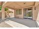 Covered back patio with neutral toned exterior and direct access to a low maintenance yard at 121 W Hackberry Dr, Chandler, AZ 85248