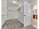 Spacious walk-in closet with ample shelving, a hanging rod, and access to the adjacent bathroom at 121 W Hackberry Dr, Chandler, AZ 85248