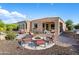 Inviting backyard with outdoor seating around a fire pit, ideal for gatherings and enjoying the outdoors at 12780 W Desert Vista Trl, Peoria, AZ 85383