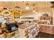Commercial cafe featuring tiled backsplash, countertop display, and assorted snacks and beverages at 12780 W Desert Vista Trl, Peoria, AZ 85383
