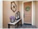 Charming front entryway with decorative wreath, lanterns, and desert-themed table at 12780 W Desert Vista Trl, Peoria, AZ 85383