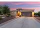 Beautiful single-story home featuring desert landscaping and a brick-lined driveway at 12780 W Desert Vista Trl, Peoria, AZ 85383