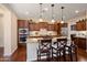 Modern kitchen featuring a large island, pendant lighting, and stainless steel appliances at 12780 W Desert Vista Trl, Peoria, AZ 85383