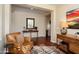 Inviting living room with an oversized chair and decoratively arranged table at 12780 W Desert Vista Trl, Peoria, AZ 85383