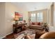 Comfortable living room features hardwood floors and plantation shutters at 12780 W Desert Vista Trl, Peoria, AZ 85383
