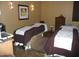 Inviting spa room featuring two massage tables with brown blankets and neutral tones at 12780 W Desert Vista Trl, Peoria, AZ 85383