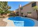 Exterior of home showcasing a swimming pool, covered patio, landscaped yard, and outdoor seating area at 1381 N Alexis Dr, Gilbert, AZ 85234