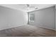 Clean bedroom featuring soft carpet and bright window at 1381 N Alexis Dr, Gilbert, AZ 85234