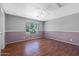 Spacious bedroom with a ceiling fan and bright window at 1381 N Alexis Dr, Gilbert, AZ 85234